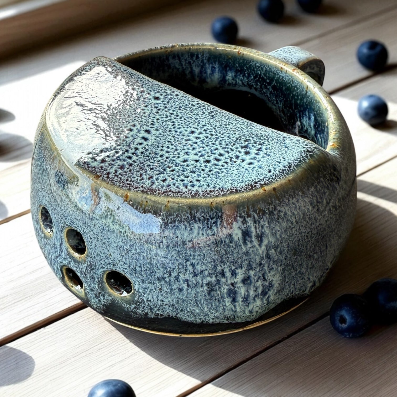 Handmade ceramic berry rinsing mug