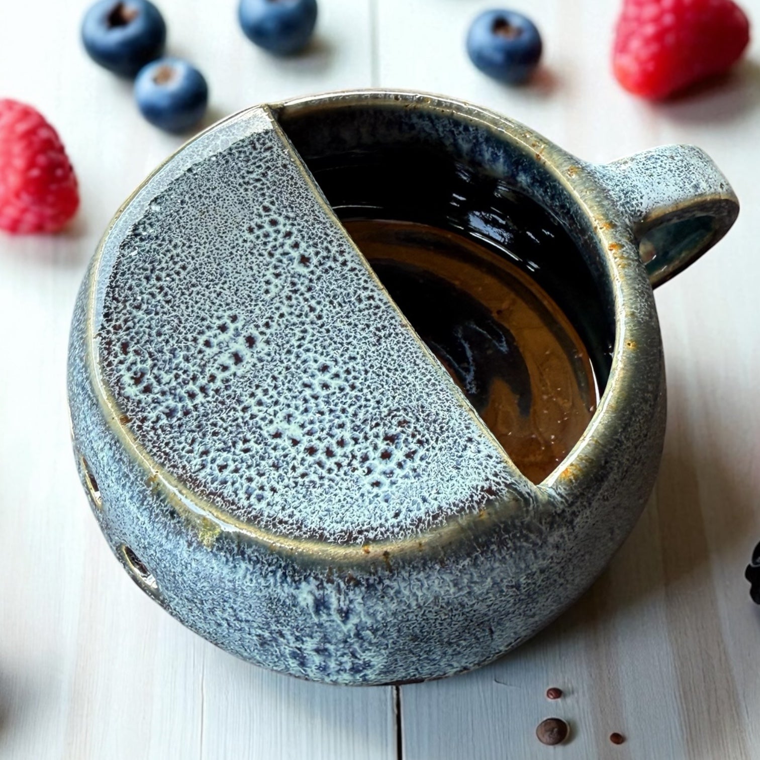 Handmade ceramic berry rinsing mug