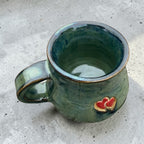 Handmade ceramic mug with hearts