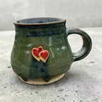 Handmade ceramic mug with hearts