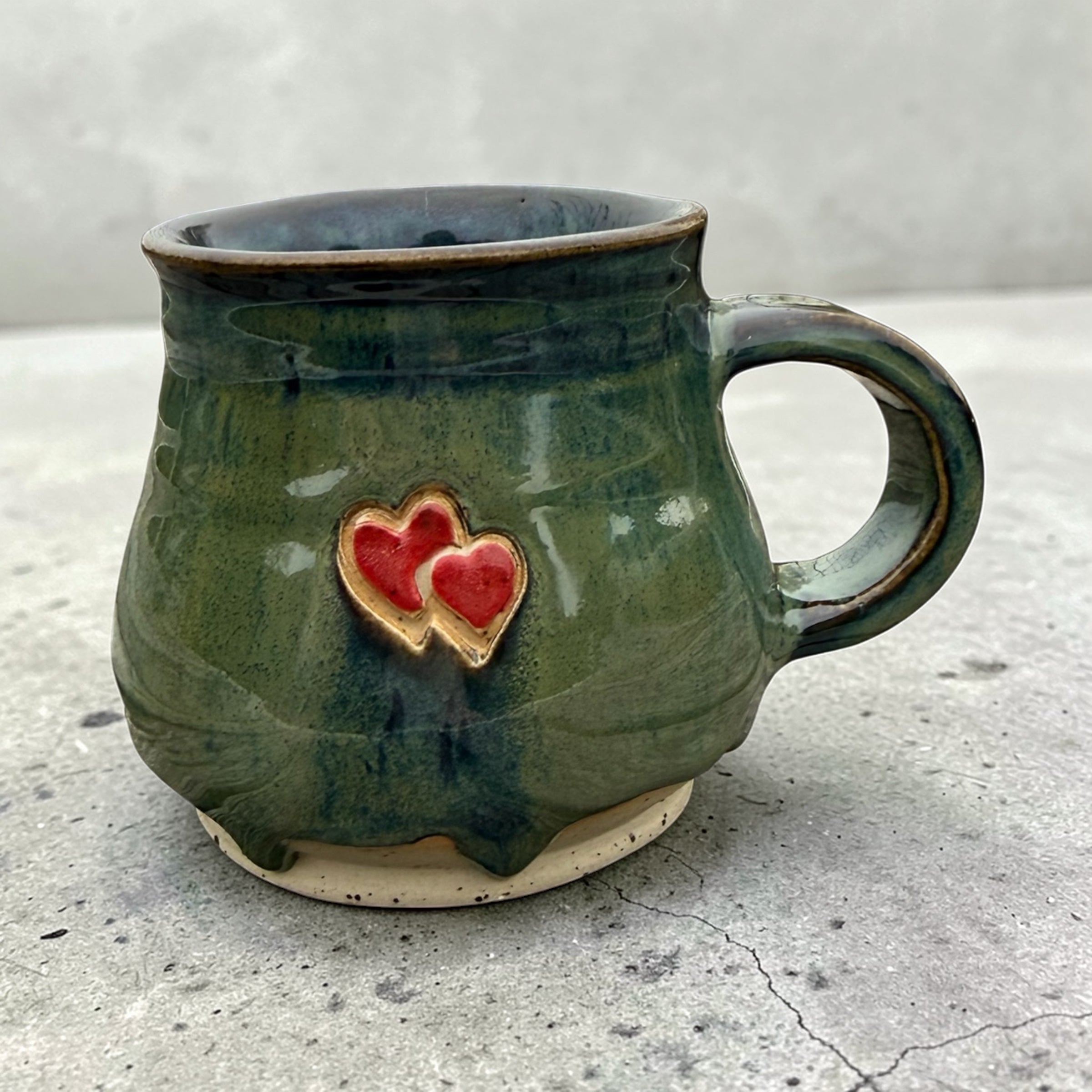 Handmade ceramic mug with hearts