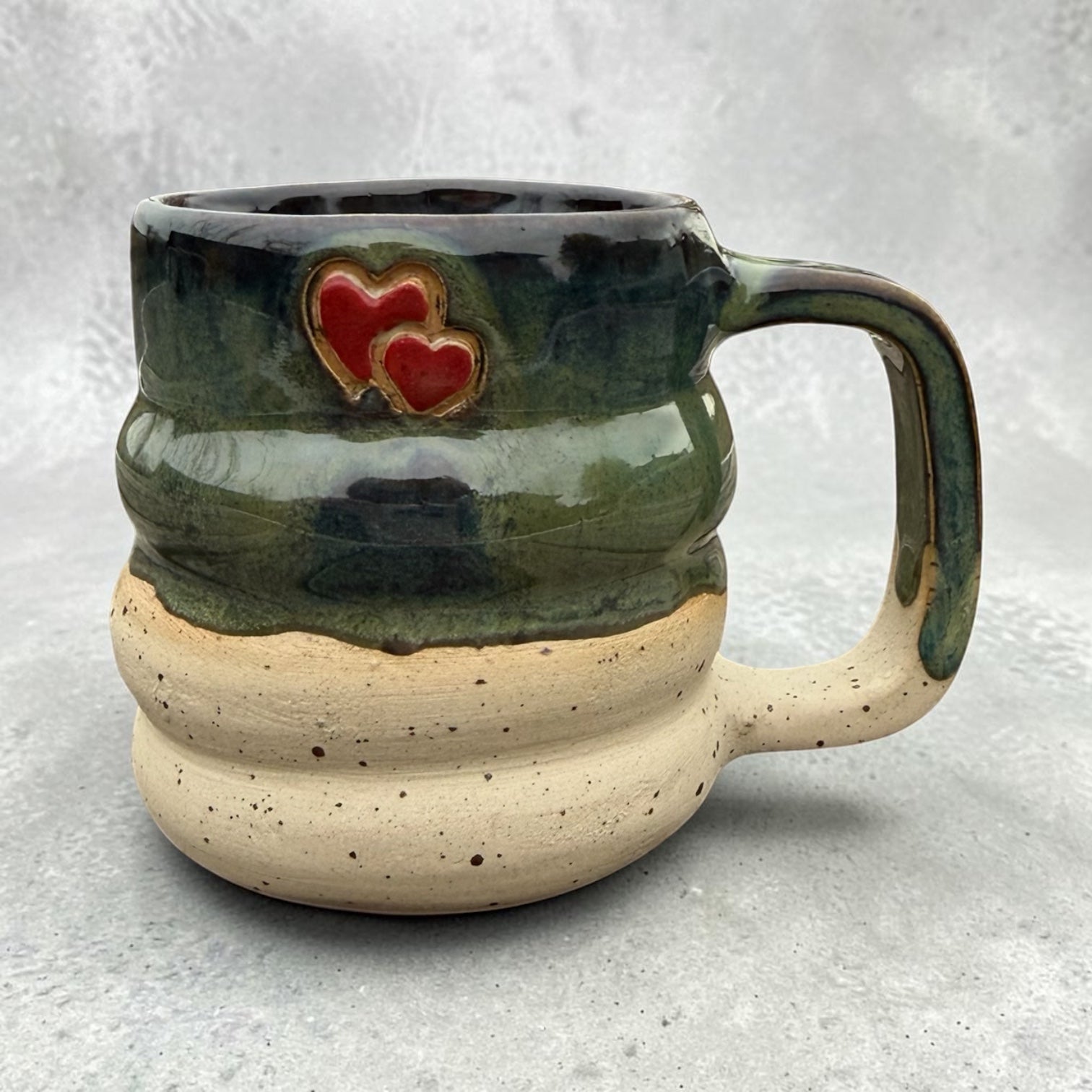 Handmade ceramic mug – green glaze with blue and brown tones